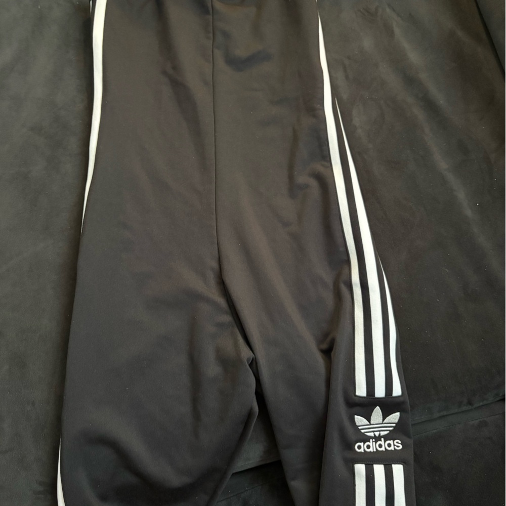 Adidas woman’s Black Joggers with White Stripes